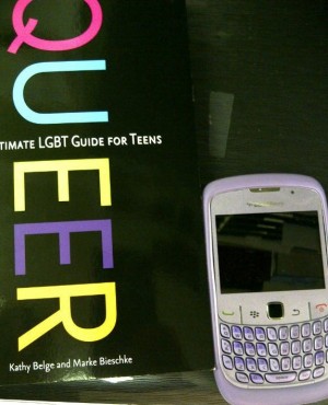 Photograph of laptop, book and smartphone
