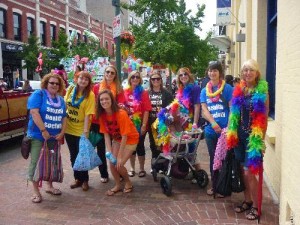 Photograph of ISH staff and volunteers dressed in rainbow colours for the 2011 Victoria Pride parade