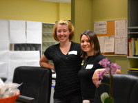Heather and Sofie standing in our new front desk of the sexual health clinic