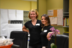 Heather and Sofie standing in our new front desk of the sexual health clinic